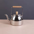 Stainless Steel Whistling Tea Kettle with Removable Infuser & Wooden Handle – 1.5L